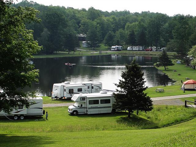  Campers parked near campground lake